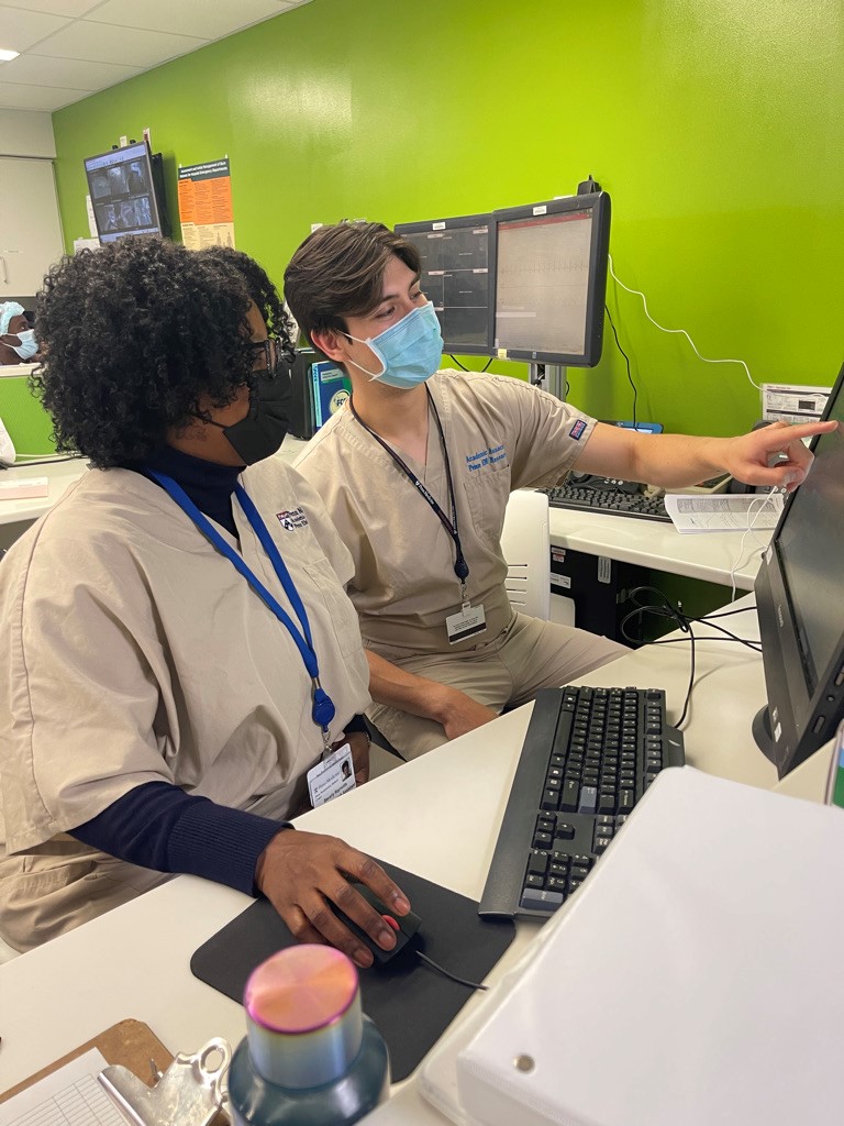 two doctors at a computer